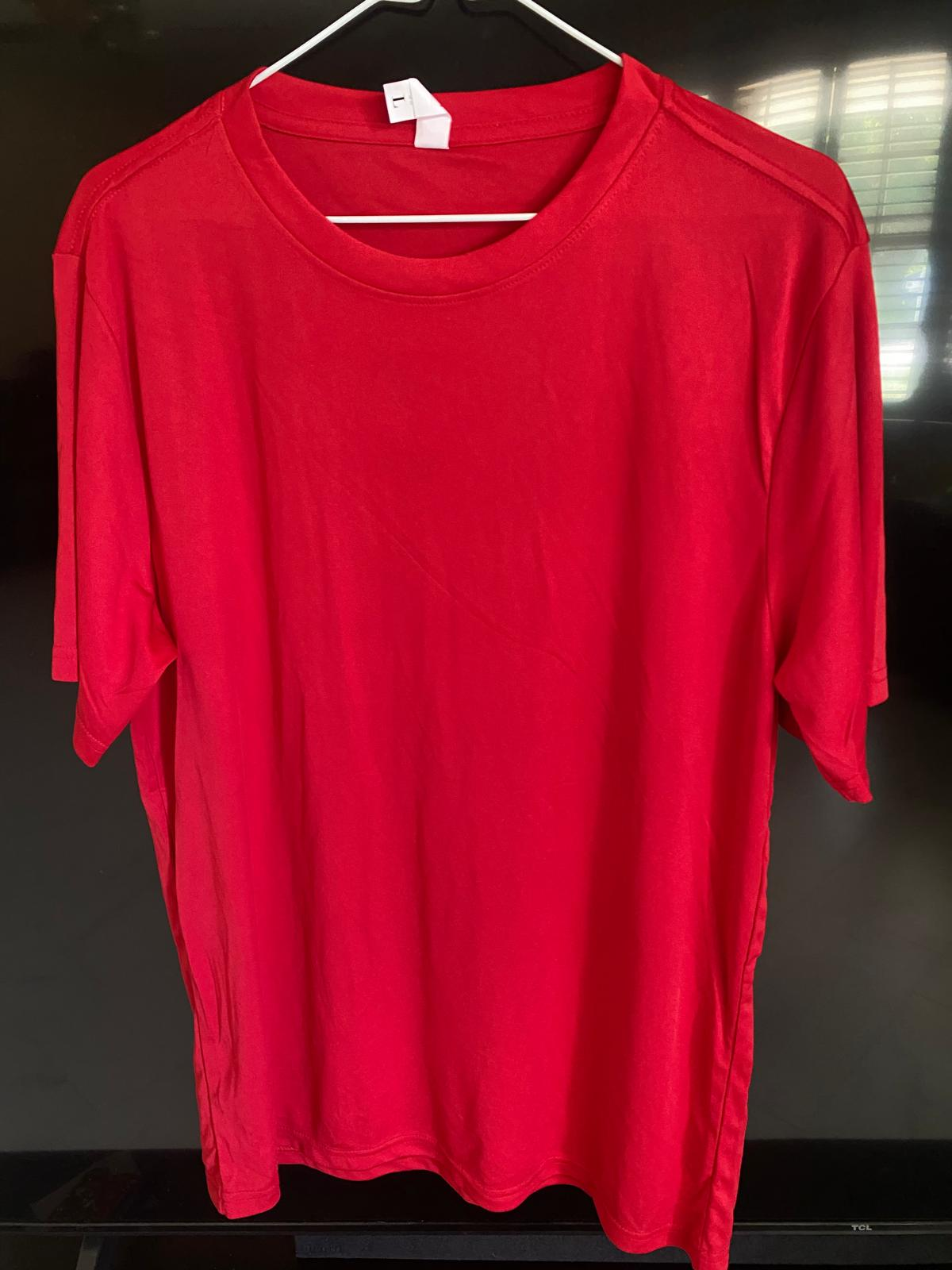 Classic red cotton t-shirt on a hanger